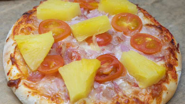 Hawaiian homemade pizza with tomatoes