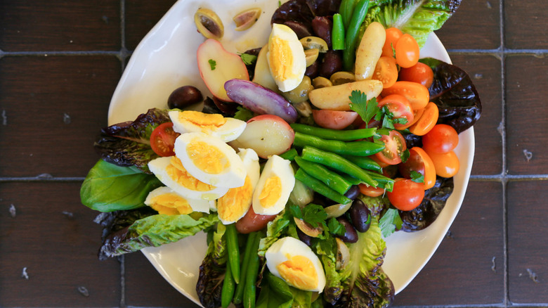 Nicoise salad with hard boiled eggs and vegetables