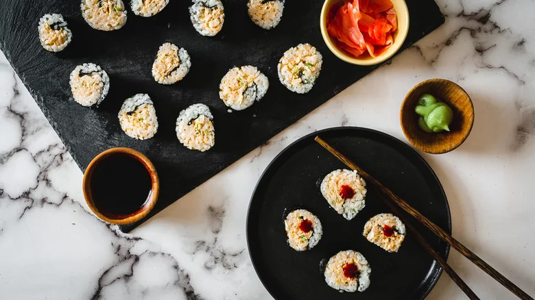 Tuna sushi-style rolls with condiments