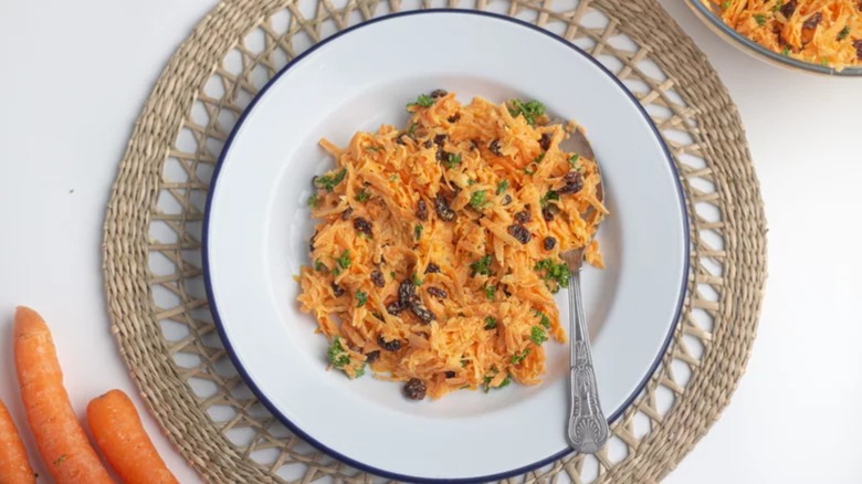 Plate of shredded carrot salad with raisins