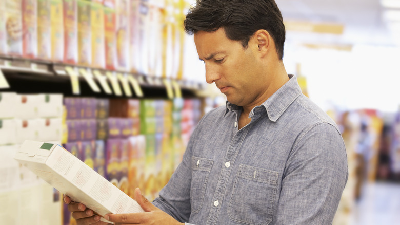 Man reading cereal box