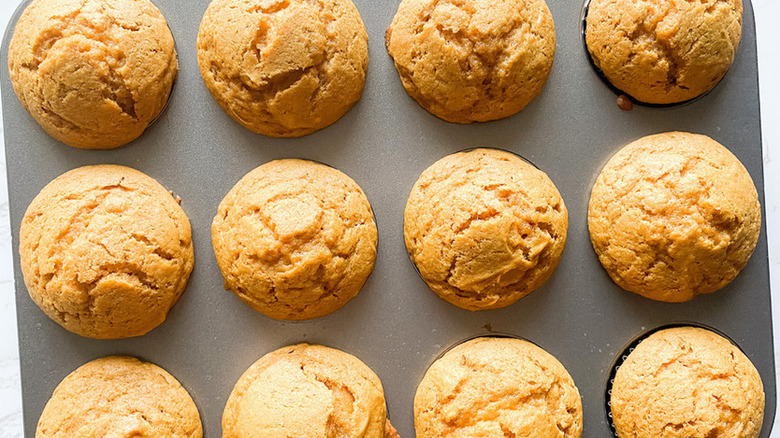 pumpkin muffins in a muffin pan. 