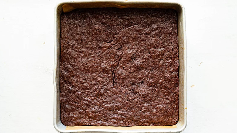 Square baking pan with baked brownies inside