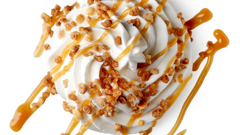 swirl ice cream with caramel sauce and nuts