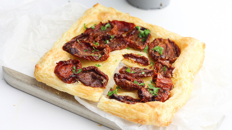 pastry topped with dried tomatoes
