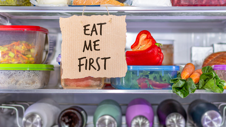 'Eat Me First' sign in fridge