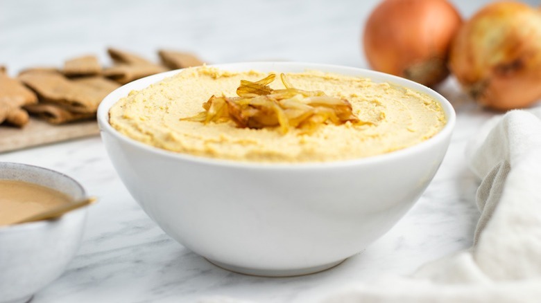 bowl of hummus with onions