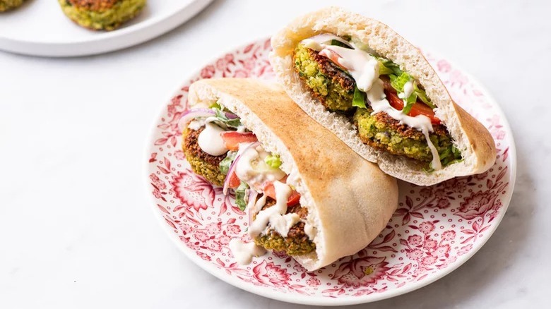 pita sandwiches on patterned plate