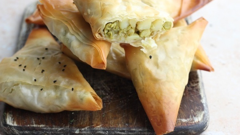 samosas piled on table