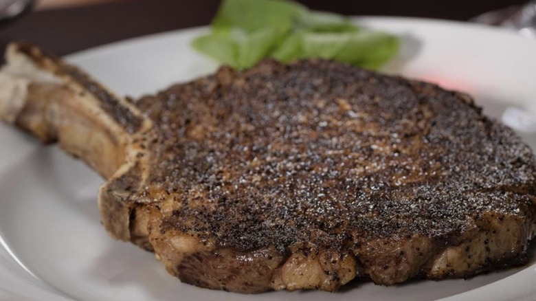 Steak on white plate from Capital Grille