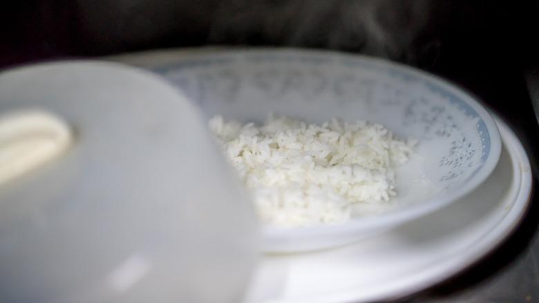 rice in bowl with microwave cover