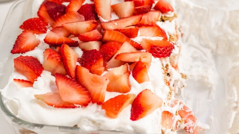 sliced strawberries with whipped topping