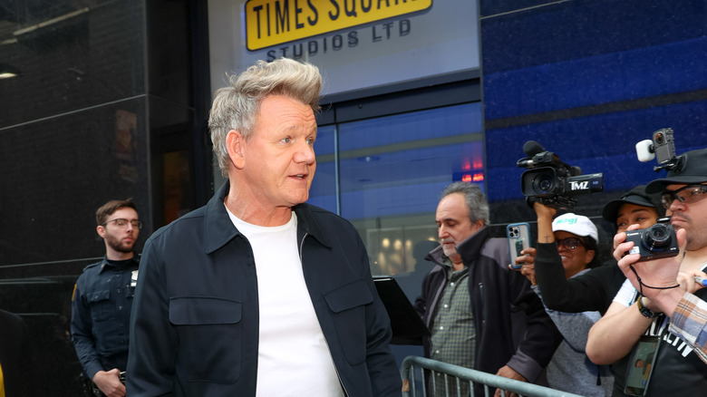 Gordon Ramsay posing for photographers