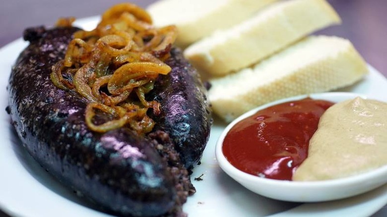 Kaszanka on a plate with condiments