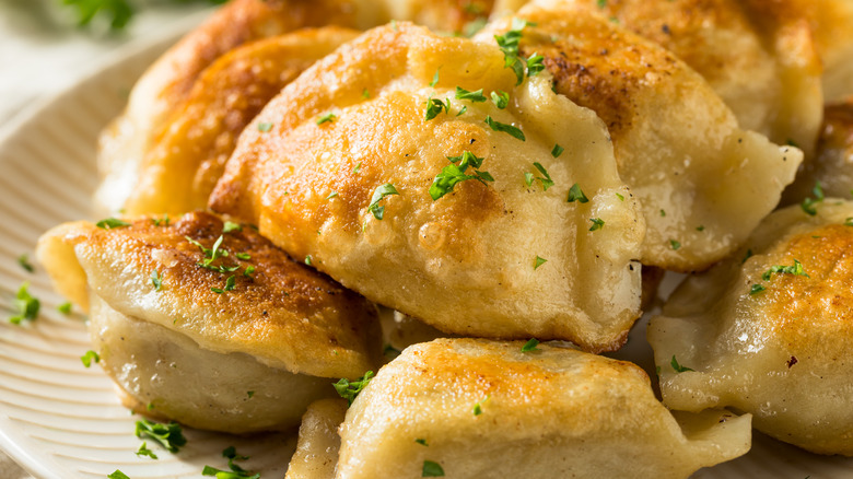 fried pierogis with parsley