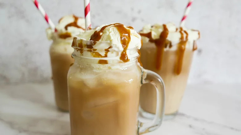 salted caramel iced coffee in glasses with straws