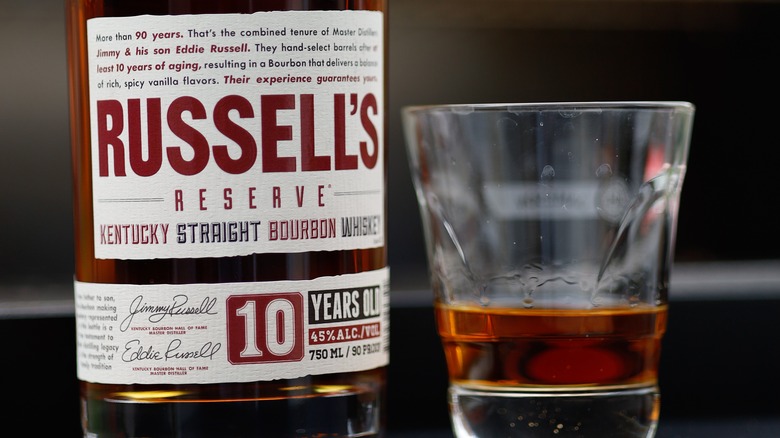 close up of Russell's Reserve and a rocks glass of whiskey