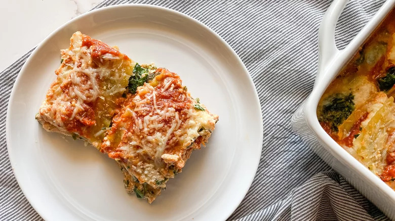 plate with cut spinach lasagna