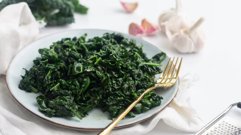 plate of mixed greens with fork