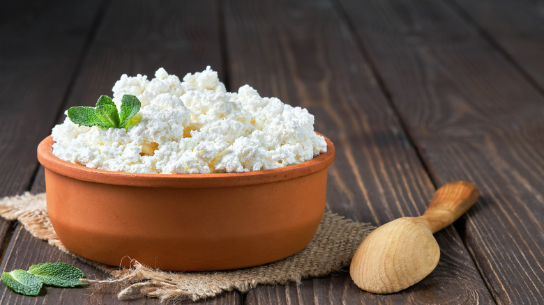 Wooden bowl of ricotta