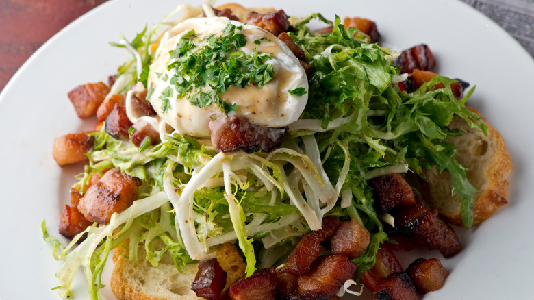 Salad with poached egg and bacon