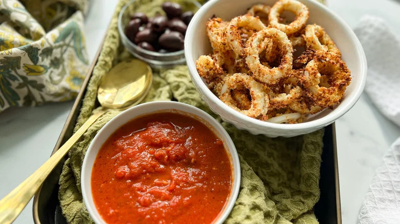 Calamari with black olives and tomato dip