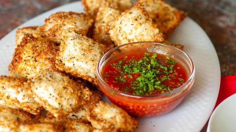 Crispy ravioli with tomato dip