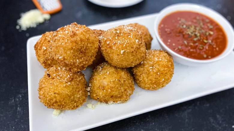 Crispy balls with Parmesan and tomato dip