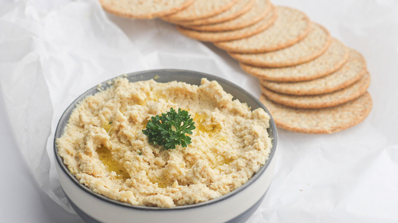 White bowl of creamy nut-based cheese spread