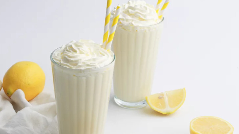 Tall glasses of lemon flavored milkshakes