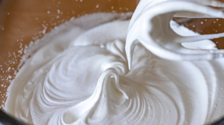 whisk and egg white meringue