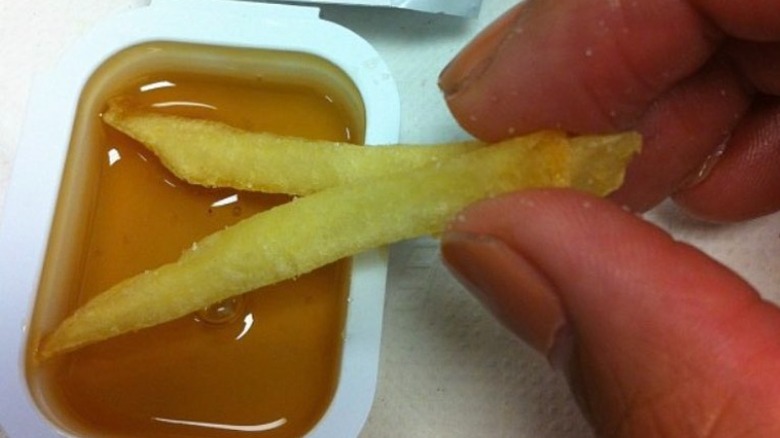 Fries dipped in honey