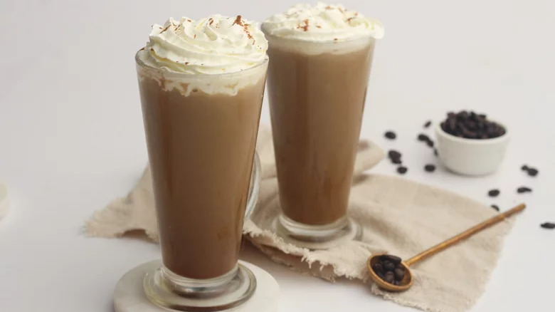 Two brown sugar lattes with whipped cream