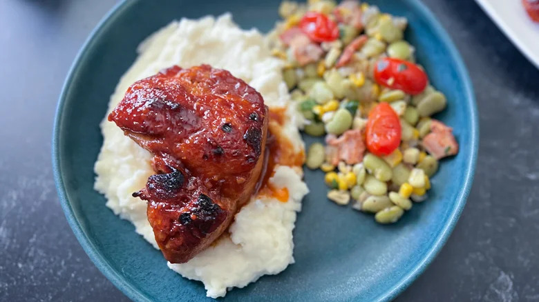 Sticky chicken on mashed potatoes wih veg