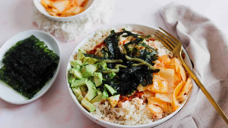 Salmon rice bowl with seaweed and avocado