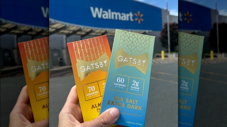 hand holding chocolate outside Walmart