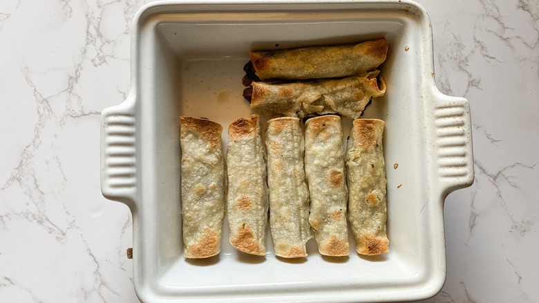 baked taquitos in dish