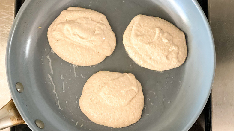 Pancake batter cooking in a pan