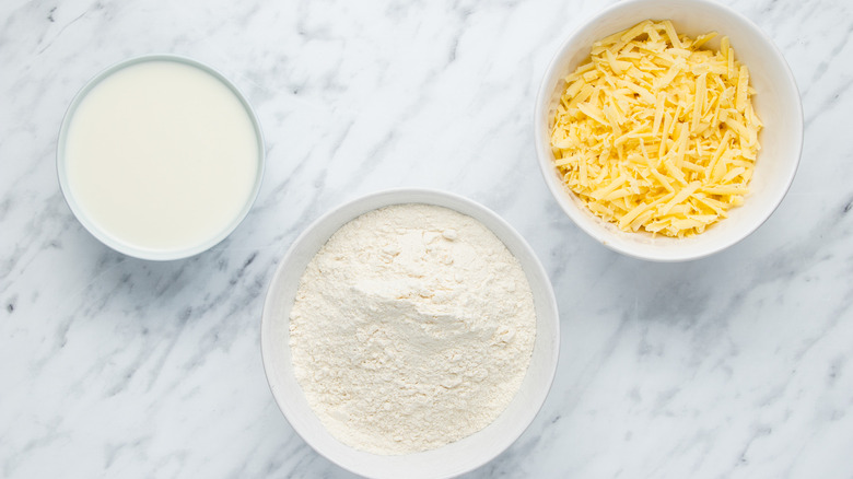 bowls of cheese, milk, flour