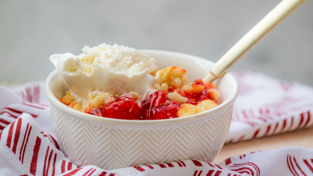 3-ingredient cherry cobbler in a bowl with ice cream