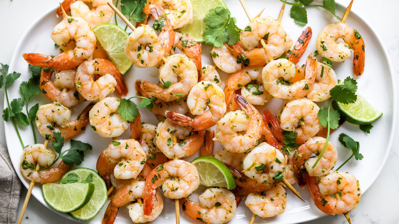 shrimp skewers on white plate