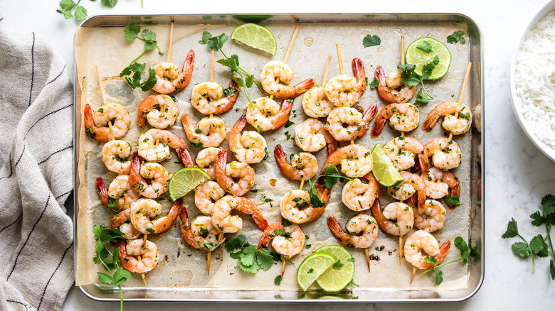 shrimp skewers on pan