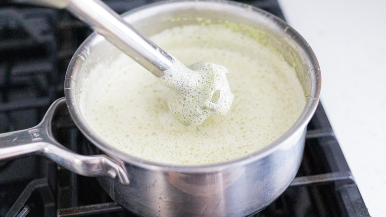 Immersion blender in soup pot