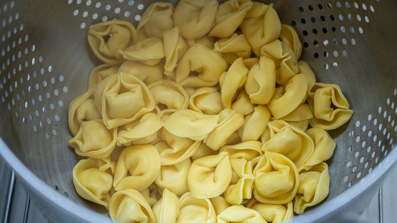 drained tortellini in colander