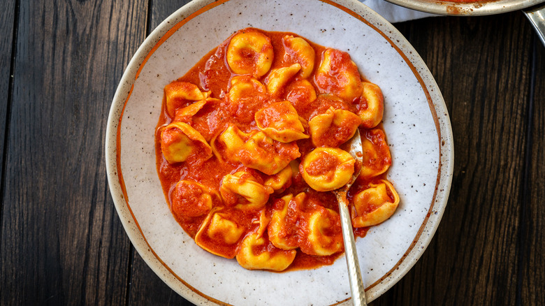 bowl of tortellini in creamy tomato sauce