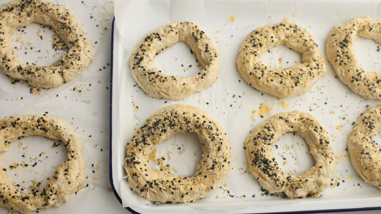 bagels on tray with seasoning