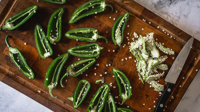 jalapeño halves on cutting board