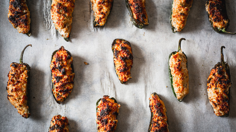 jalapeño poppers on baking sheet