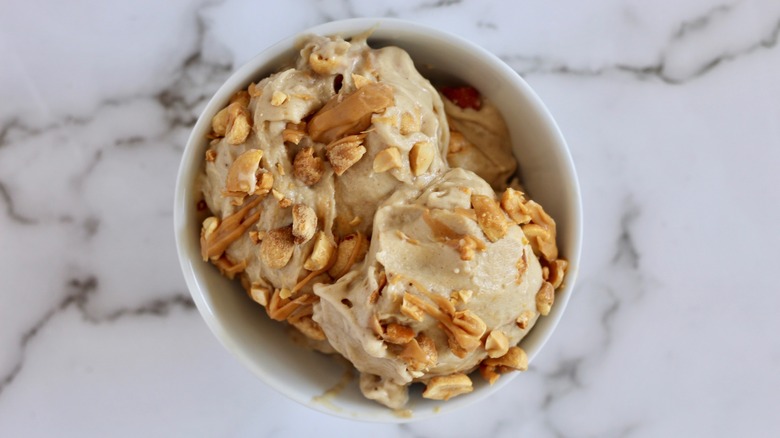 Close up of peanut butter ice cream in a white bowl