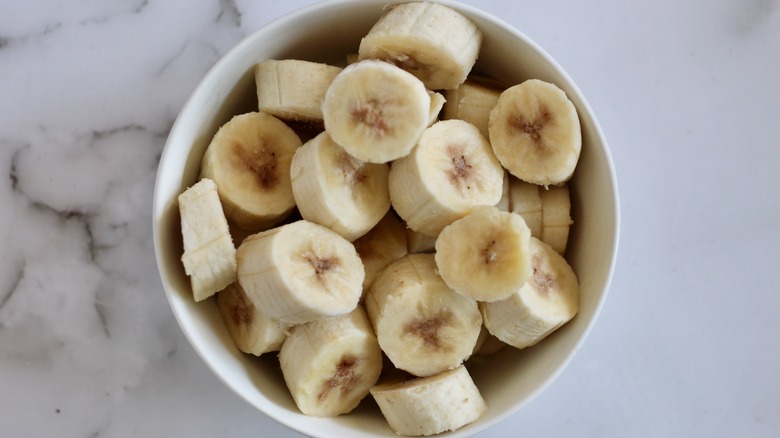 Frozen bananas in a white bowl